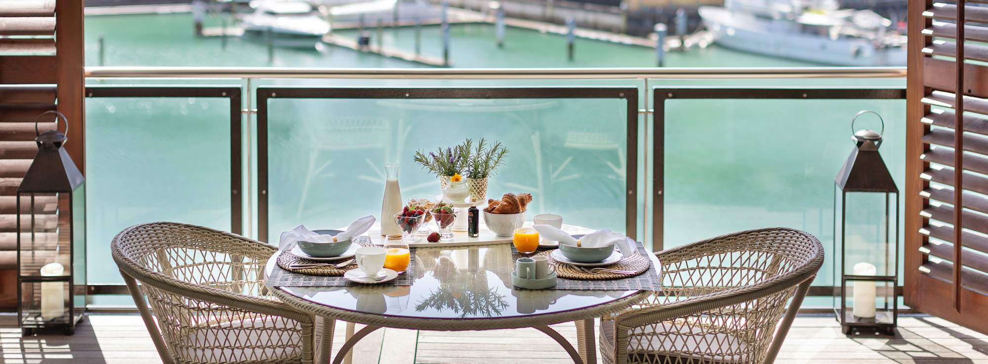 Luxury Breakfast Setting, Modern Cane Furniture & Harbour views | Point Residence Luxury Auckland Waterfront Accommodation